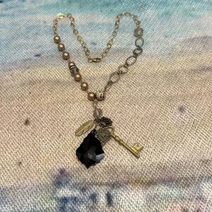 Women's unique, mixed-material Gold-Tone Charm necklace.